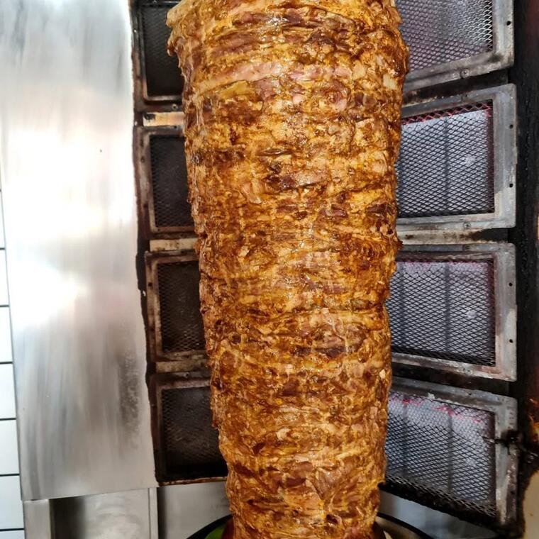 The shawarma spit turning