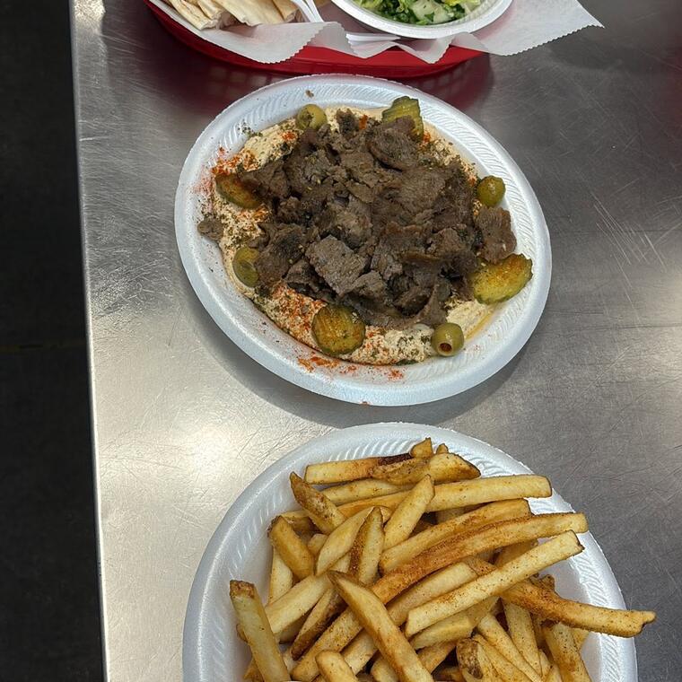 Pita and salad, a gyro plate and a plate of fries